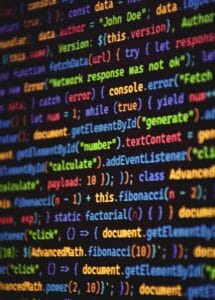 Close-up of vibrant colored JavaScript code showing functions and syntax on a dark screen.